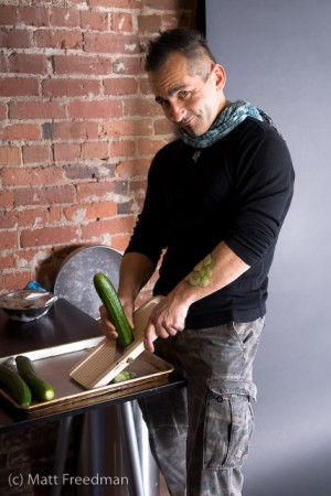 Tiberio slicing the cucumbers